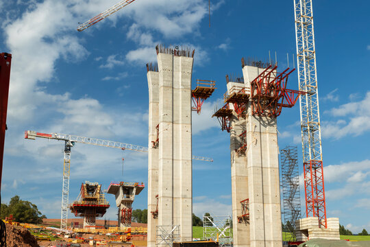 Building highway viaduct pillars with towering cranes in Czechia