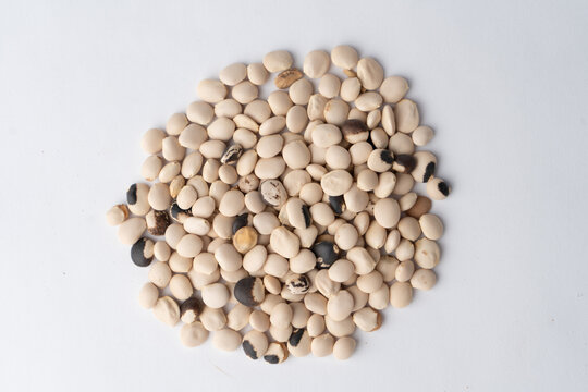 Lupin beans beige legumes pile top view dry plant based food ingredient on white background
