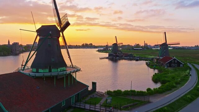 Aerial view of windmills at famous tourist site Zaanse Schans in Holland on sunset. Zaandam, Netherlands