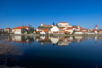 Obraz premium Ptuj cityscape reflecting in the Drava River, Slovenia