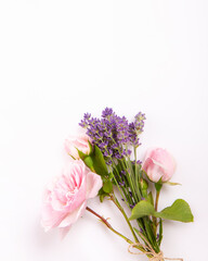 Obraz premium Pink rose and lavender bouquet on soft light background, delicate vertical floral composition with copy space. Romantic wedding, feminine greeting card, beauty, wellness, spring design