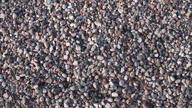 Construction Gravel Close Up Rough Aggregate Texture, Small Crushed Stones Forming Dense Industrial Surface, Neutral Gray And Brown Tones, Coarse Tactile Detail Suitable For Concrete Mix,