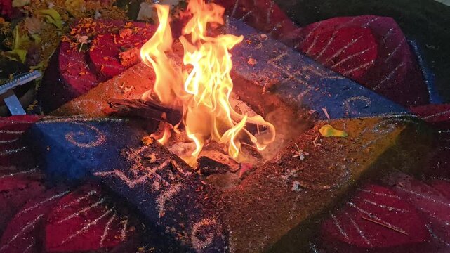 Sacred Fire Ritual Havan Kund in Hindu Ceremony, Holy Flame with Offerings and Gheee, Spiritual Yajna Ritual, Devotional Worship and Religious Tradition India