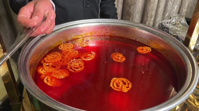 Fresh hot Jalebi being fried in an Indian wedding