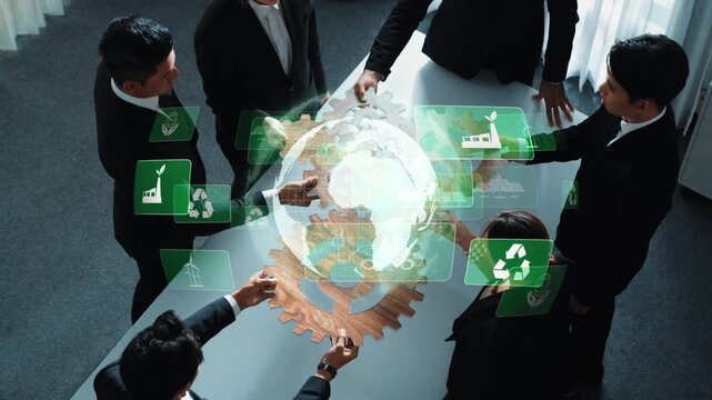 A business team collaborates in a modern office, leveraging technology to discuss sustainable practices. A virtual globe and icons visualize their innovative strategies. Raster