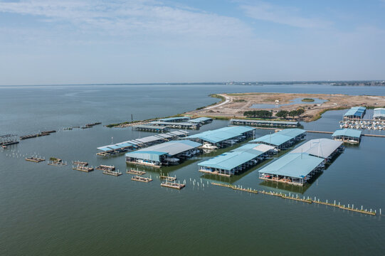 Large Boat Docks and Buildings on Lake in Harbor of Rockwall, Texas