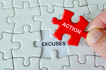 Fototapeta premium ACTION and EXCUSES, Close up of a hand placing a red action puzzle piece above the word action on a white jigsaw background