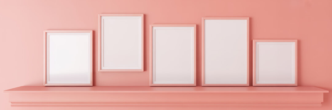 Five blank frames on a pink shelf wall