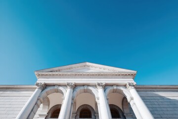 Naklejka premium Classical white government building facade with corinthian columns under clear blue sky exterior architecture and civic institution entrance