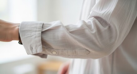 Fototapeta premium Close Up Detail of Wrinkled Light Gray Linen Shirt Sleeve