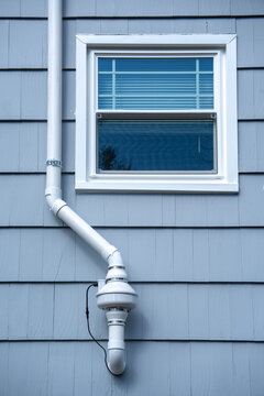 radon mitigation installed system outside the house