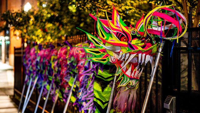 Portland, United States - 17 February 2026: View of vibrant dragon heads, a riot of neon colors against the dark backdrop in Lan Su Chinese Gardens..