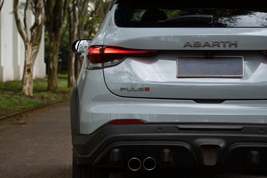 Gray Fiat Pulse Abarth rear half close up, sports crossover sporty design details in outdoor setting