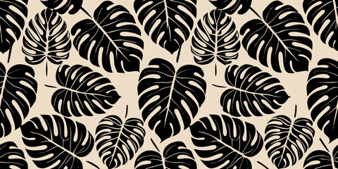 Seamless pattern of tropical monstera leaves in black and beige tones © Huraya