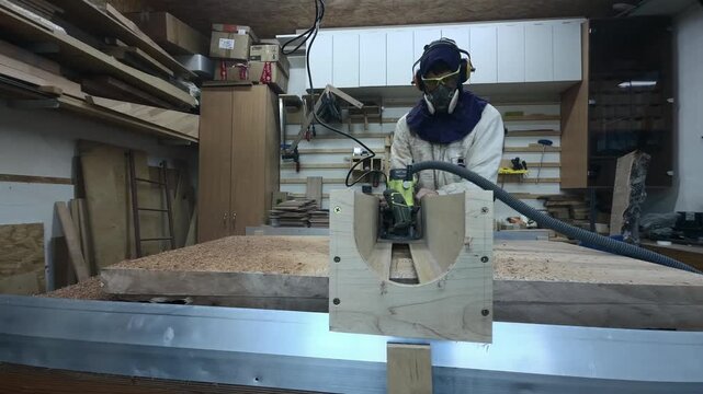 Cinematic Profile Tracking of Faceless Creator Milling Wood Slab in Messy Garage Workshop Slow Motion Unfiltered Craftsmanship