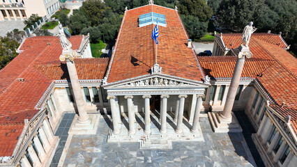 Obraz premium Aerial drone photo of historic Neoclassic building of Academy of Athens featuring statue of goddess Athena in Acadimias street, Attica, Greece