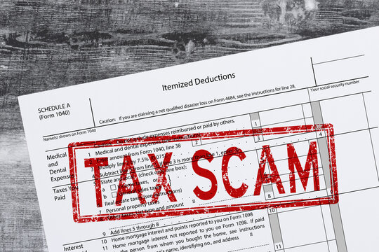 Tax scam stamp on tax form fraud concept