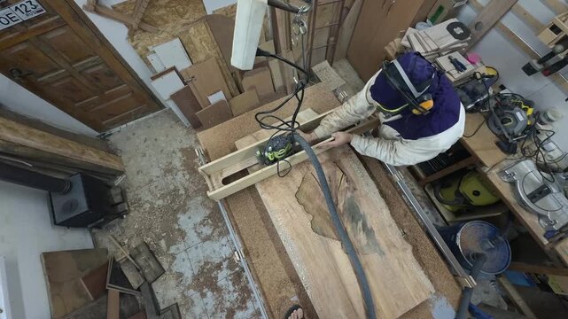 Labor Intensive Wood Slab Surfacing with Heavy Duty Router and Sled System High Angle Pan Slow Motion Authentic Gritty Workshop