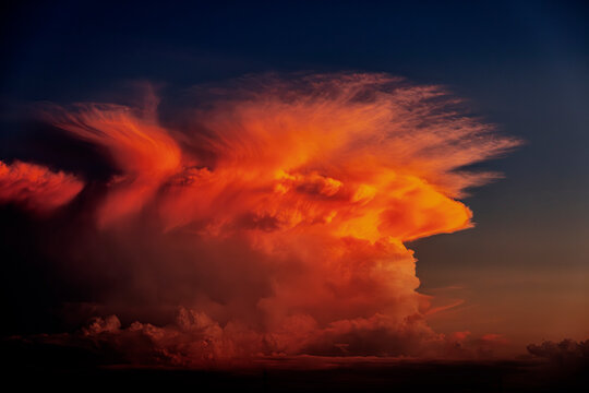 Stunning Sunset Sky with Vibrant Orange Cloud Formation - Breathtaking Evening View