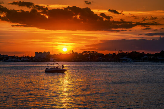 Fishing from a boat at sunset in the Indian river lagoon New Smyrna Beach Florida, USA