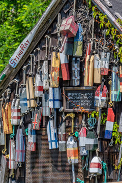 Discover the Charm of a Nautical Fisherman's Shack Decked with Colorful Lobster Buoys, Annisquam, Massachusetts, USA