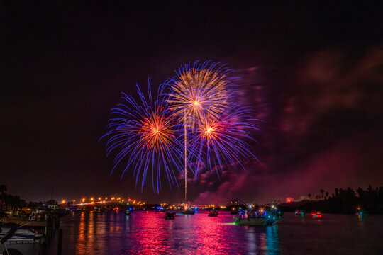 Spectacular Fireworks Display Over a Vibrant Night Sky in Florida, Indian River Lagoon, New Smyrna Beach, USA