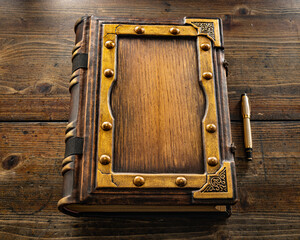vintage leather book on the table with blank central part of the cover