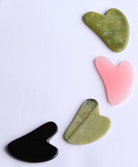 Obraz premium four multi-colored gua sha made of natural stone