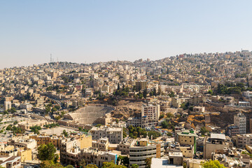 Fototapeta premium Dense urban cityscape with residential buildings and hillside terrain
