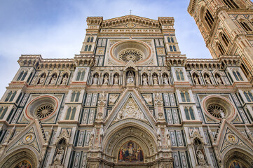 Fototapeta premium Ornate marble facade of the famous Duomo Cathedral in Florence, Italy