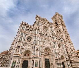 Fototapeta premium Ornate marble facade of the famous Duomo Cathedral in Florence, Italy