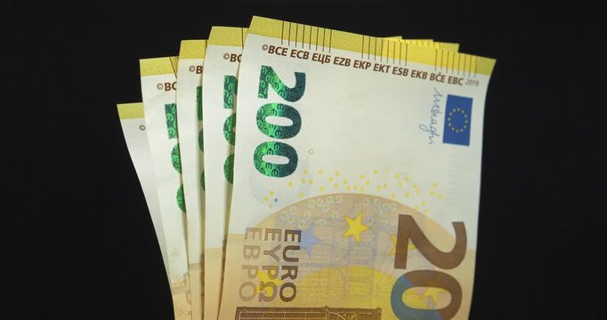 Euro banknotes, EUR. New green two hundred Euro banknotes. European Money. Cash, finance, savings, wealth. One thousand Euros in five 200 euro banknotes