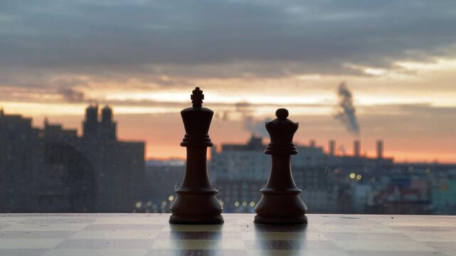 A conceptual minimalist photo focusing on a single wooden chess queen piece on a board. The shallow depth of field isolates the subject against a bright, blurred background, representing strategy, lea
