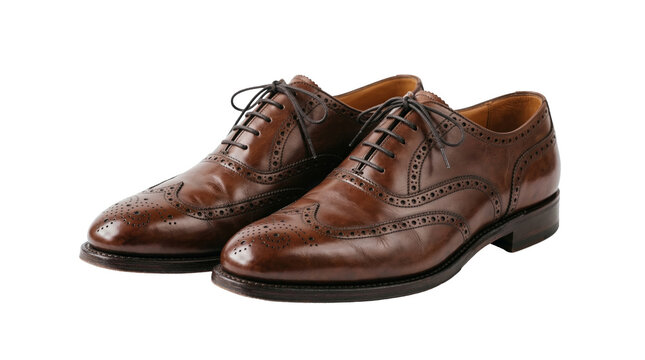 Opened ingredientMen's formal oxford shoes in polished brown leather, showing subtle patina and brogue detailing. The white background creates a timeless, professional presentation for business attire