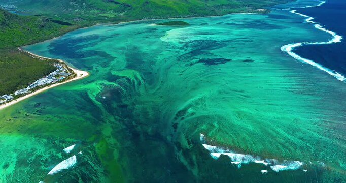 Aerial view of Underwater waterfall in a coral reef with turquoise water. Island Mauritius in the Indian Ocean