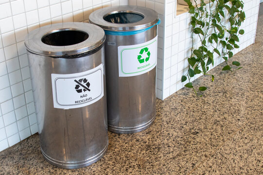 Selective waste collection with bins for recyclable and non-recyclable waste.