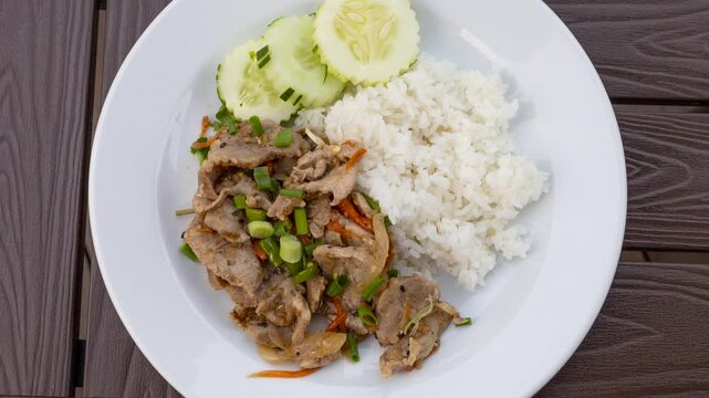 Rotating Plate of Spicy Stir Fried Pork and Basil (Pad Kra Pao)