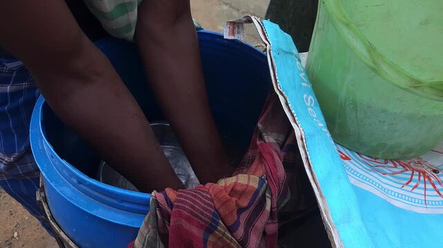 Fish farmer manually counting fish fry fish seed before releasing them into a freshwater pond for commercial aquaculture in Odisha, India, fish seed production, hatchery management, pond stocking