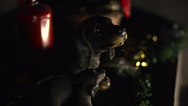 Silent Holiday Ornament. Luminous Candle Casts Deep Shadows On Glossy Holiday Dachshund Decoration. Media