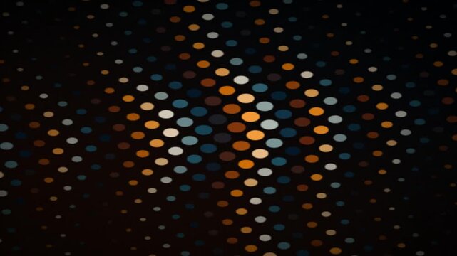 Abstract pattern of glowing colorful dots on a dark background, creating a digital or pixelated effect.