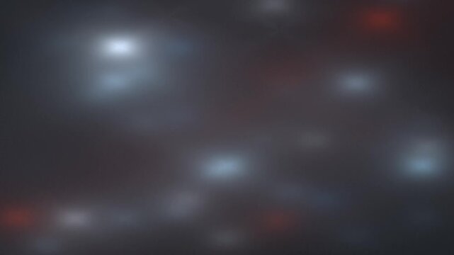 An abstract and blurry image featuring multiple diffuse light sources against a dark, reddish-grey background, evoking a sense of deep space or distant celestial bodies.