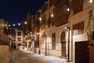 Fototapeta premium Atmospheric night view of traditional Roshan balconies in Al Balad, the Old Town of Jeddah in Saudi Arabia