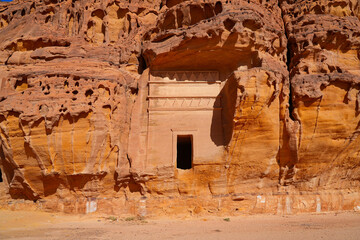 Solitary Nabataean tomb carved into a massive sandstone monolith in Hegra, AlUla, Saudi Arabia © Alexandre ROSA