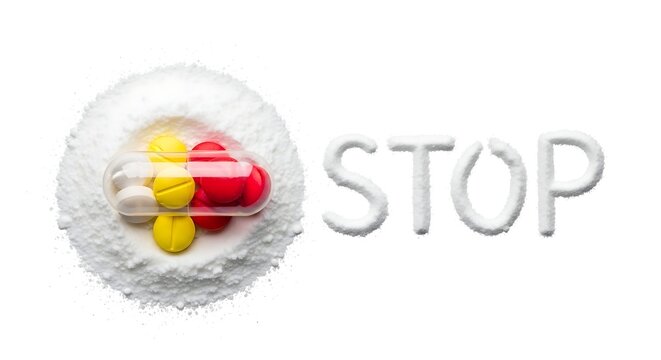 A conceptual image showing a transparent pill capsule filled with tablets on a white powder pile