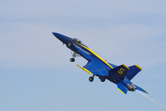 Blue Angels Boeing F/A‑18 Super Hornet climbing  sharply over Sacramento, California, United States, March 23, 2025.