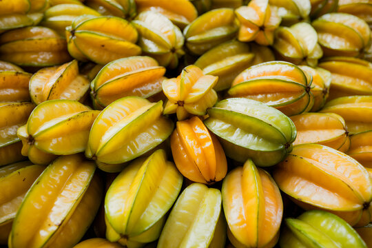 Fresh starfruit pile with yellow and green skin