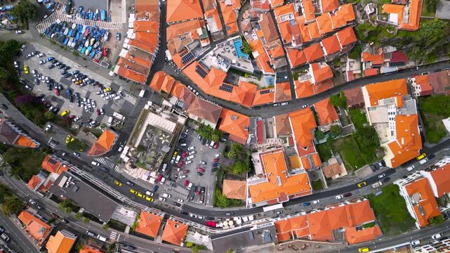 Aerial top down view of Camara de Lobos town in Madeira island.