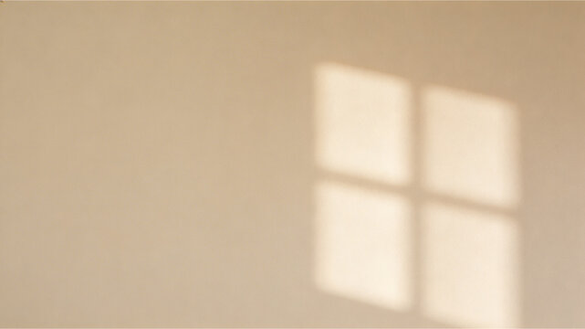 Minimal beige wall with soft window shadow, natural light abstract background