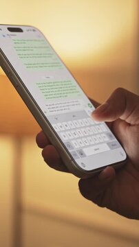 Man hands chatting and typing on smartphone macro closeup. Unrecognizable human typing text message tapping touchscreen keyboard using whatsapp application a social media