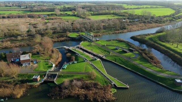 Drone view of the vast hydraulic engineering works at Denver Sluice Complex highlighting the critical flood barrier system within the Norfolk Fens